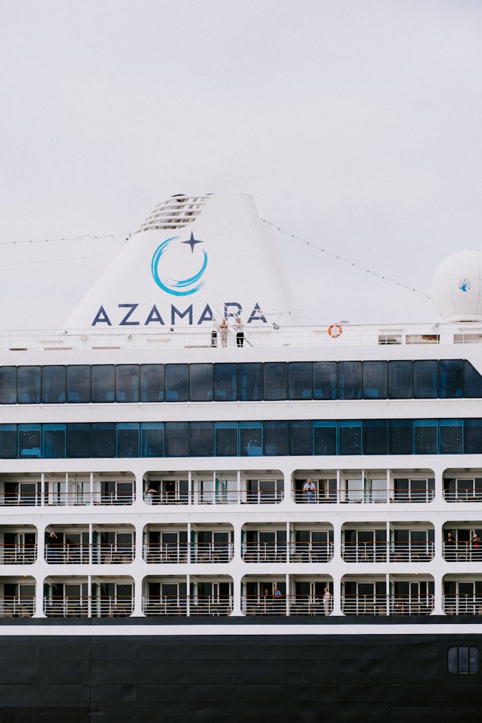 Close-up of a luxury cruise ship, highlighting balconies and elegant design. Ideal for travel and tourism content.